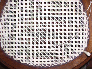 rounded cane chair close up